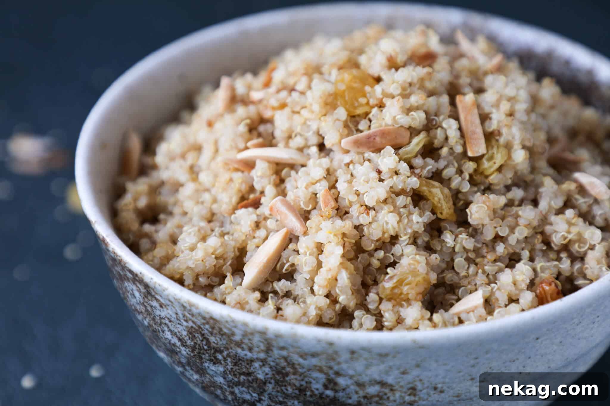 Quinoa Pilaf served in a beautiful bowl, showing its fluffy texture and inviting aroma from a side perspective