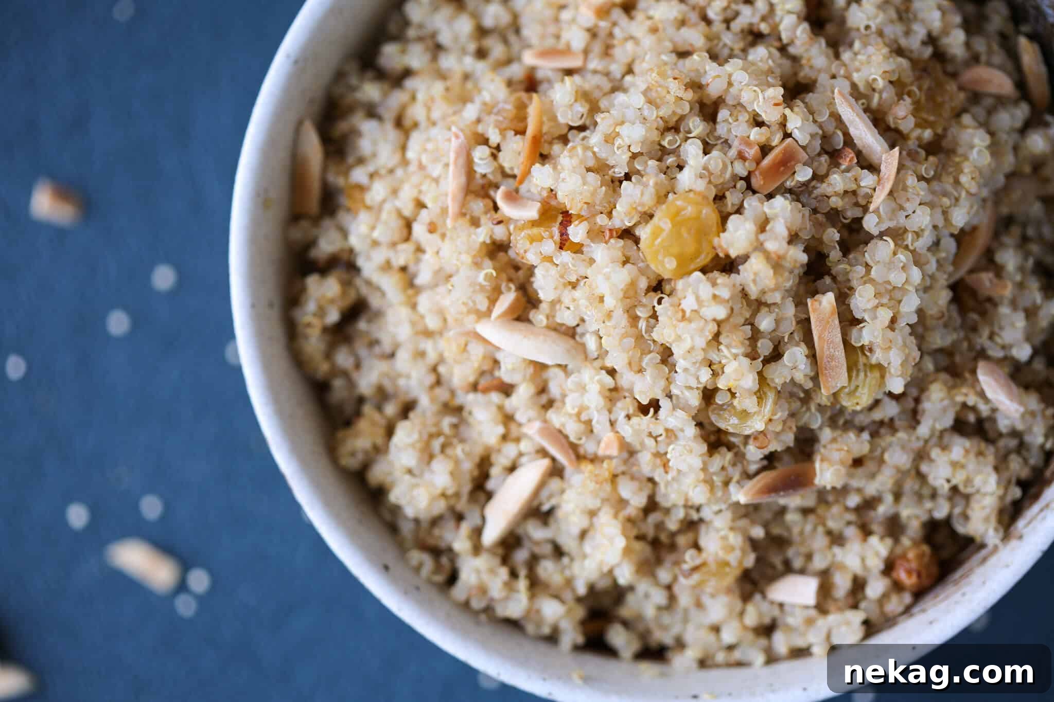 Top-down view of a vibrant grain side dish, highlighting the fluffy quinoa and colorful additions, perfect for meal inspiration