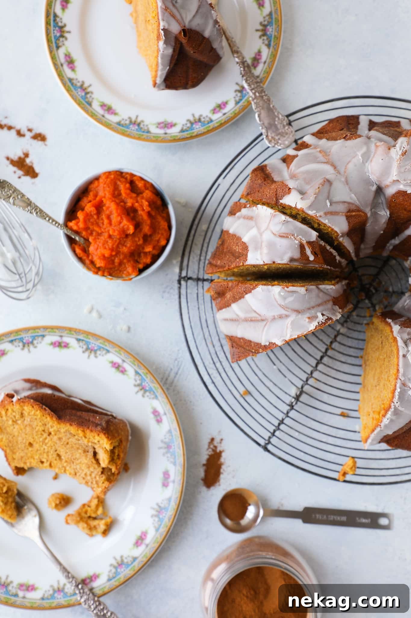 Pumpkin Harvest Bundt Bliss 2 A stunning pumpkin spice bundt cake, perfectly baked and ready to be glazed, set on a rustic wooden table amidst autumn leaves and small pumpkins, embodying the cozy fall dessert theme.