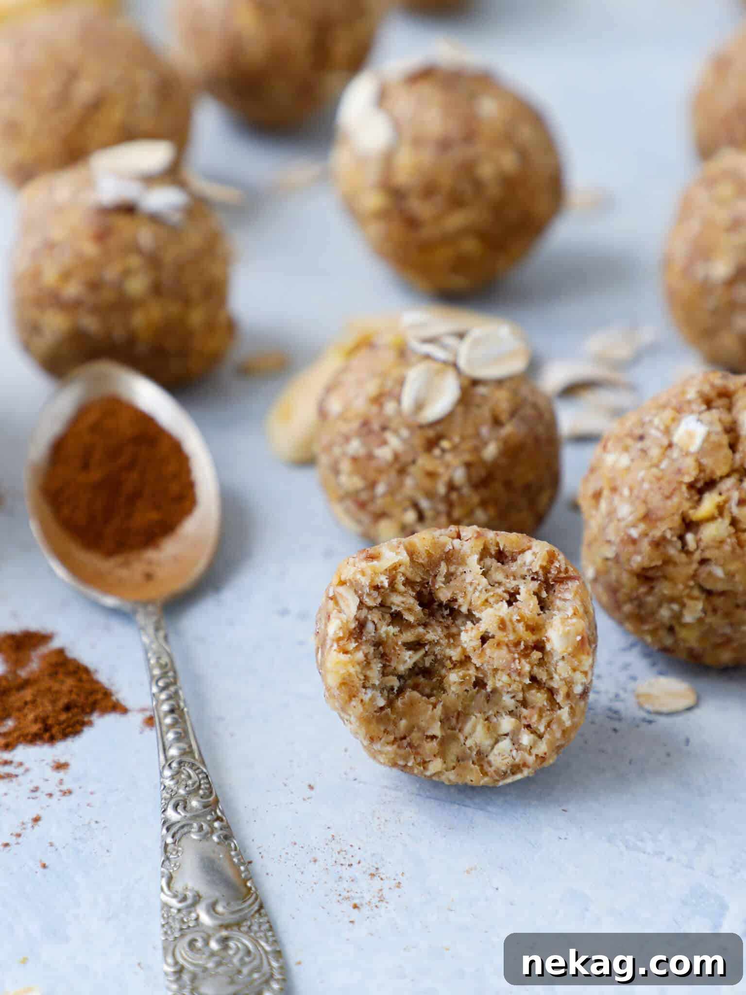 Spiced Apple Crisp Energy Bites 2 Apple Crisp Energy Bites Interior - a close up shot of a bitten energy bite showing the texture and ingredients