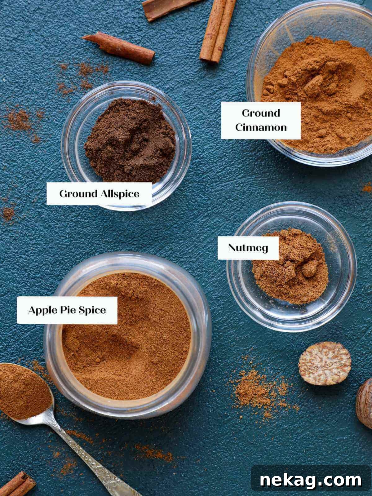 Sweet Apple Pie Seasoning 3 Bowls of cinnamon, nutmeg, and allspice arranged on a turquoise surface.