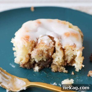 Irresistible Cream Cheese Cinnamon Rolls 8 Close-up view of the interior of a perfectly baked cinnamon roll, showing its soft layers and rich filling.