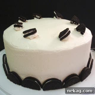 Assembled Oreo Cheesecake Cake with frosting