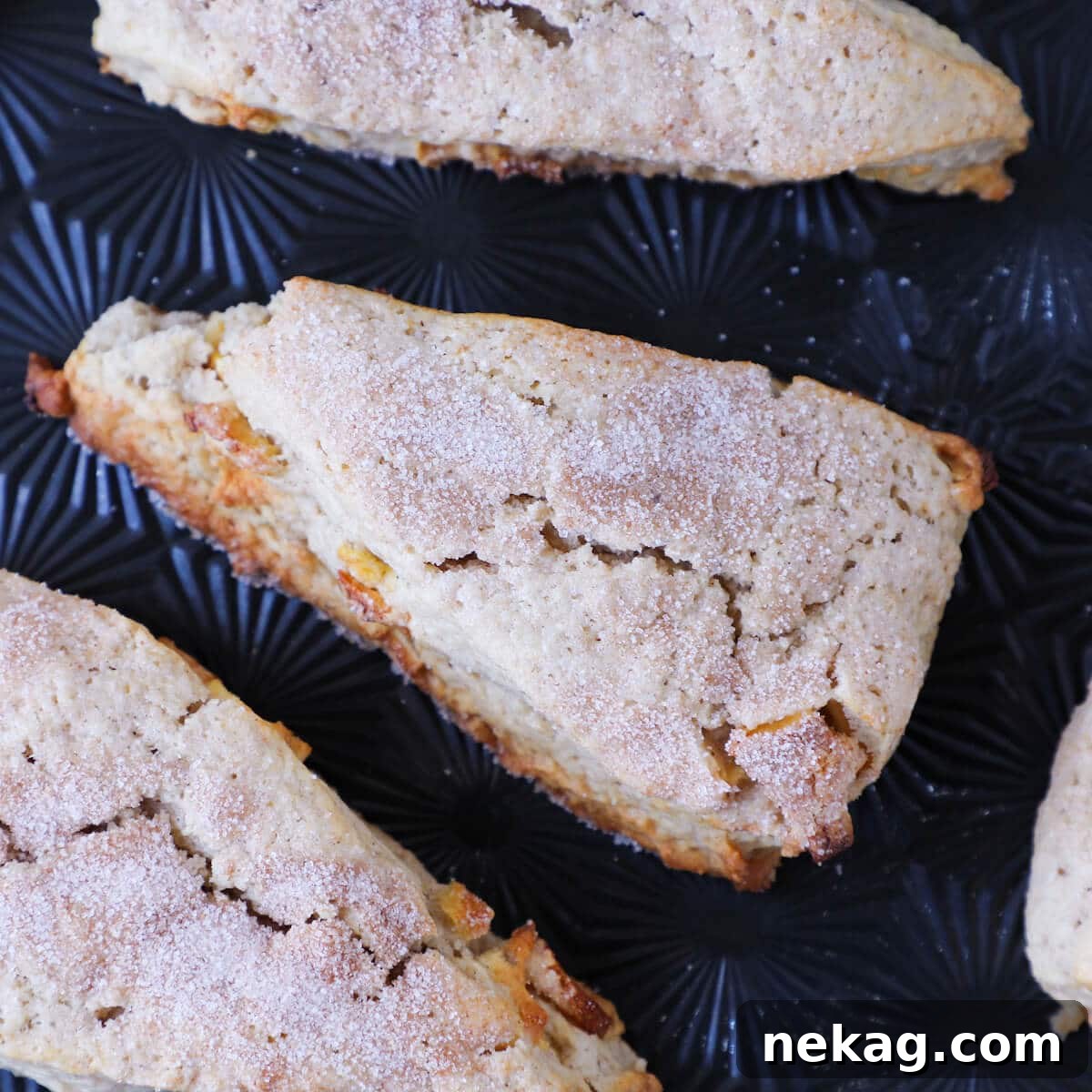 Close-up of a spiced apple scone showing its beautifully cracked top.