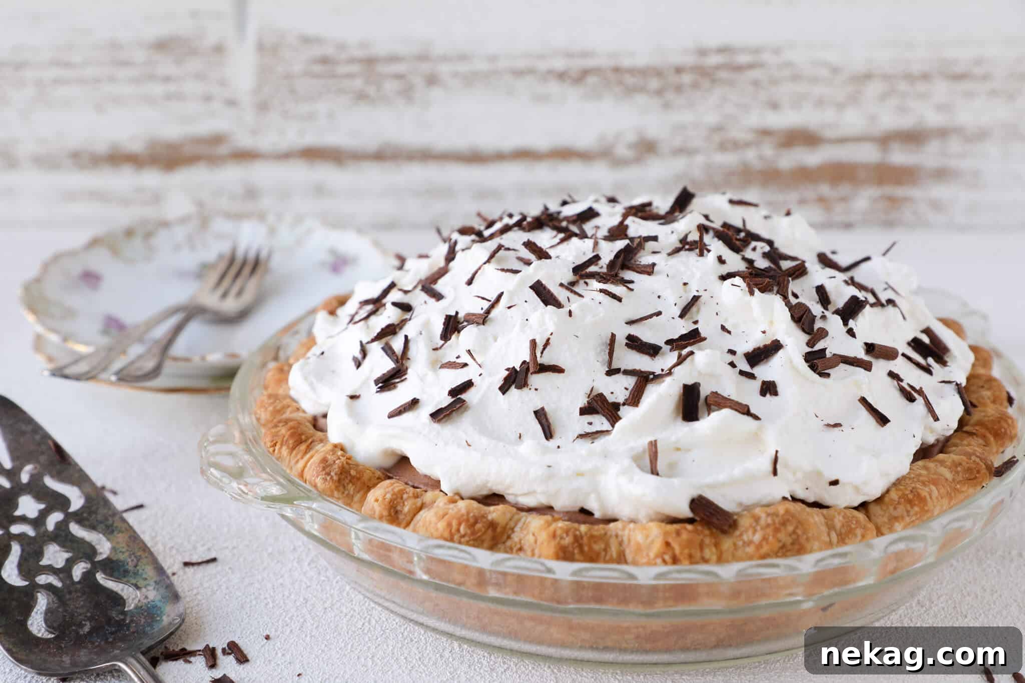 Flawless Crusts The Docking Dilemma Solved 6 A beautiful French Silk Pie in a glass dish, showcasing a perfectly baked, non-soggy crust, ideal for delicate fillings.