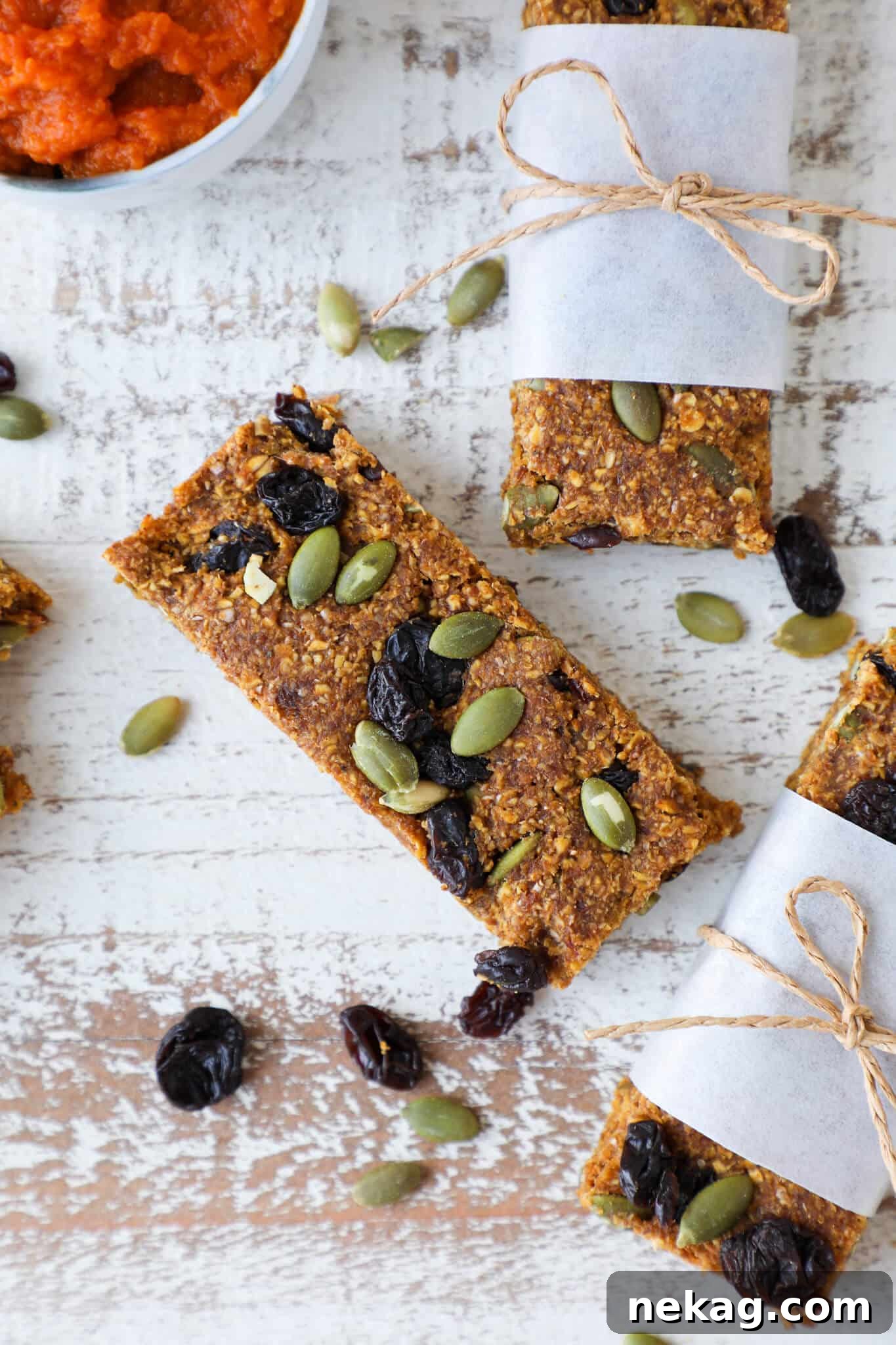 Pumpkin Spice Energy Bars topped with pumpkin seeds, a healthy snack option.