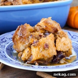 Close-up of pumpkin bread pudding studded with cherries and pecans.