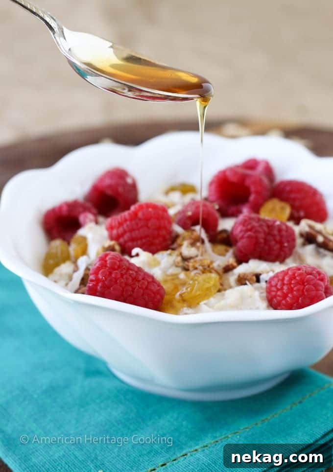 Close-up of creamy Bircher Muesli with a spoon, highlighting its smooth texture and appetizing appearance