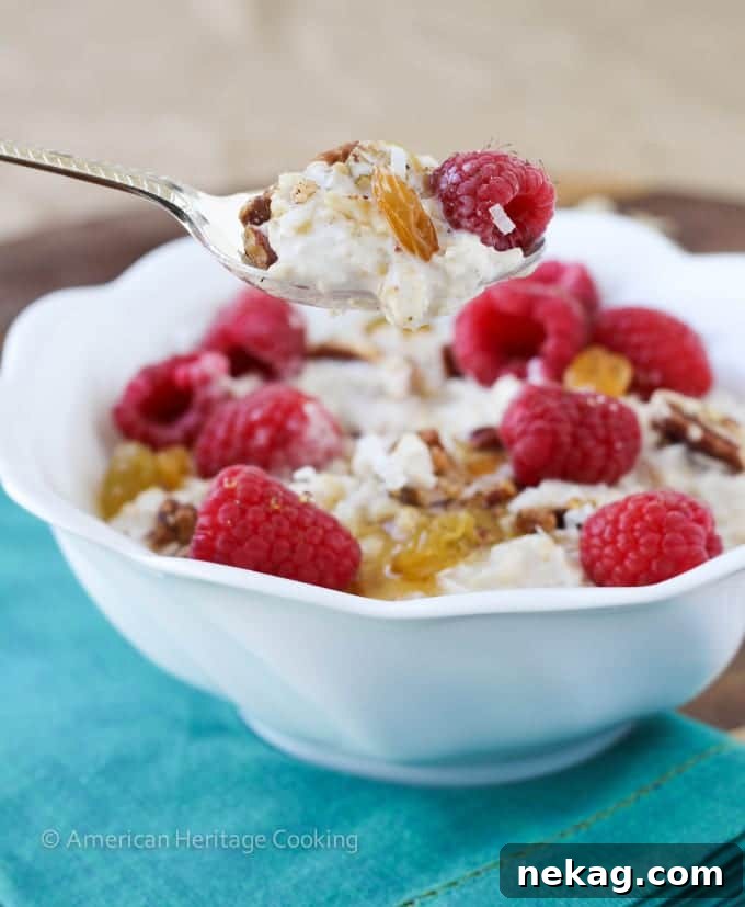 A serving of Bircher Muesli topped with fresh berries and toasted nuts, ready to enjoy