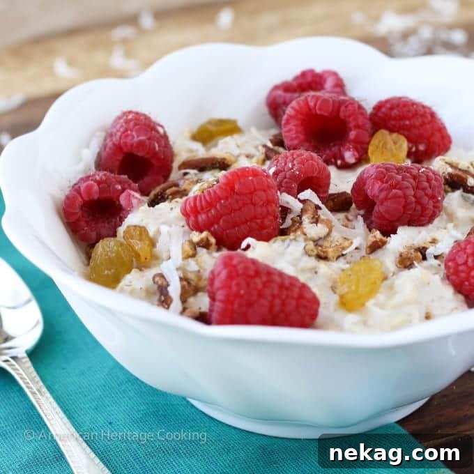 A bowl of Bircher Muesli, close-up on the mix of oats, apple, and toppings