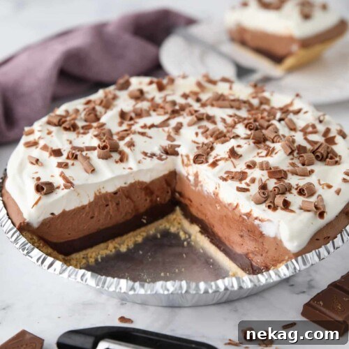 Chocolate Truffle Pie in pan with pieces taken out to show filling.