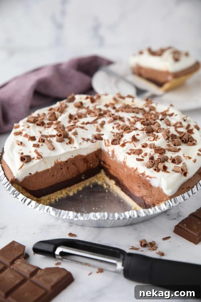 Chocolate Truffle Pie in pan with pieces taken out to show filling.