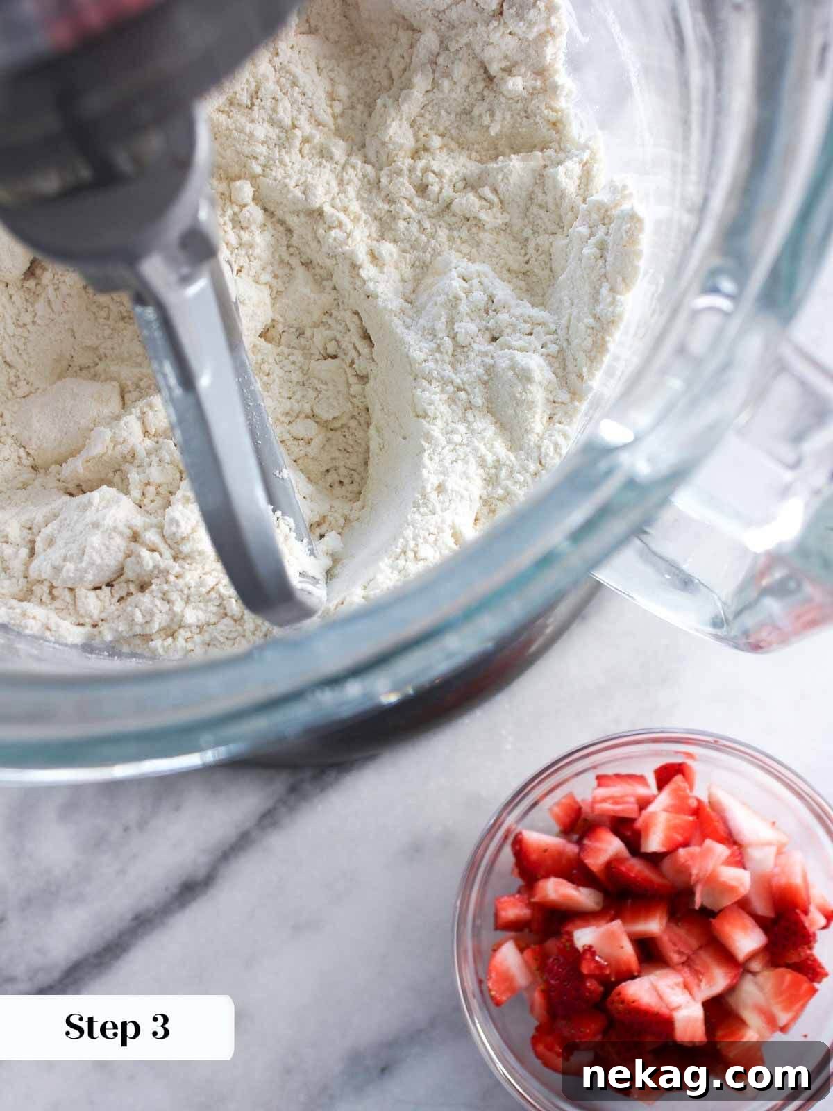 Homemade Strawberry Scones 4 Dry ingredients and cubed cold butter in a mixer bowl, ready to be combined for strawberry scones.