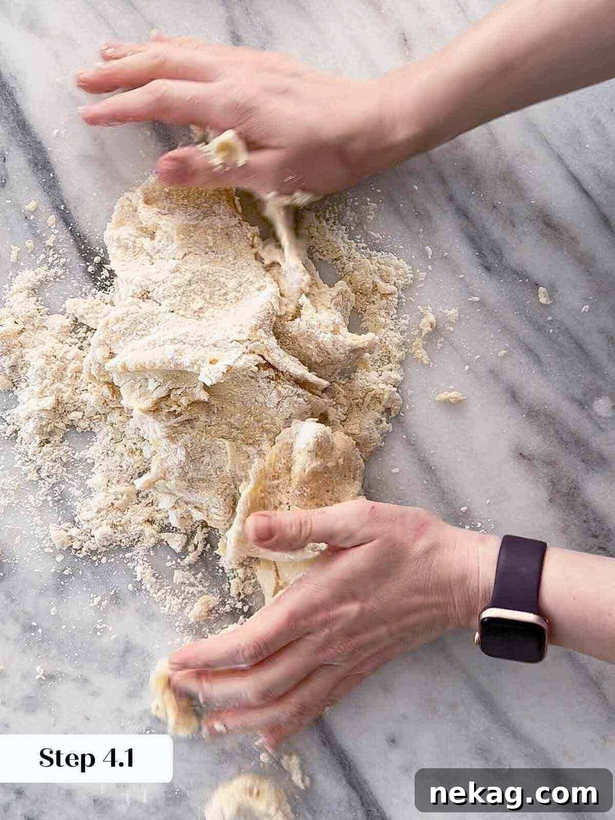 Homemade Strawberry Scones 5 Close-up of butter being cut into dry flour mixture in a stand mixer, forming coarse crumbs.