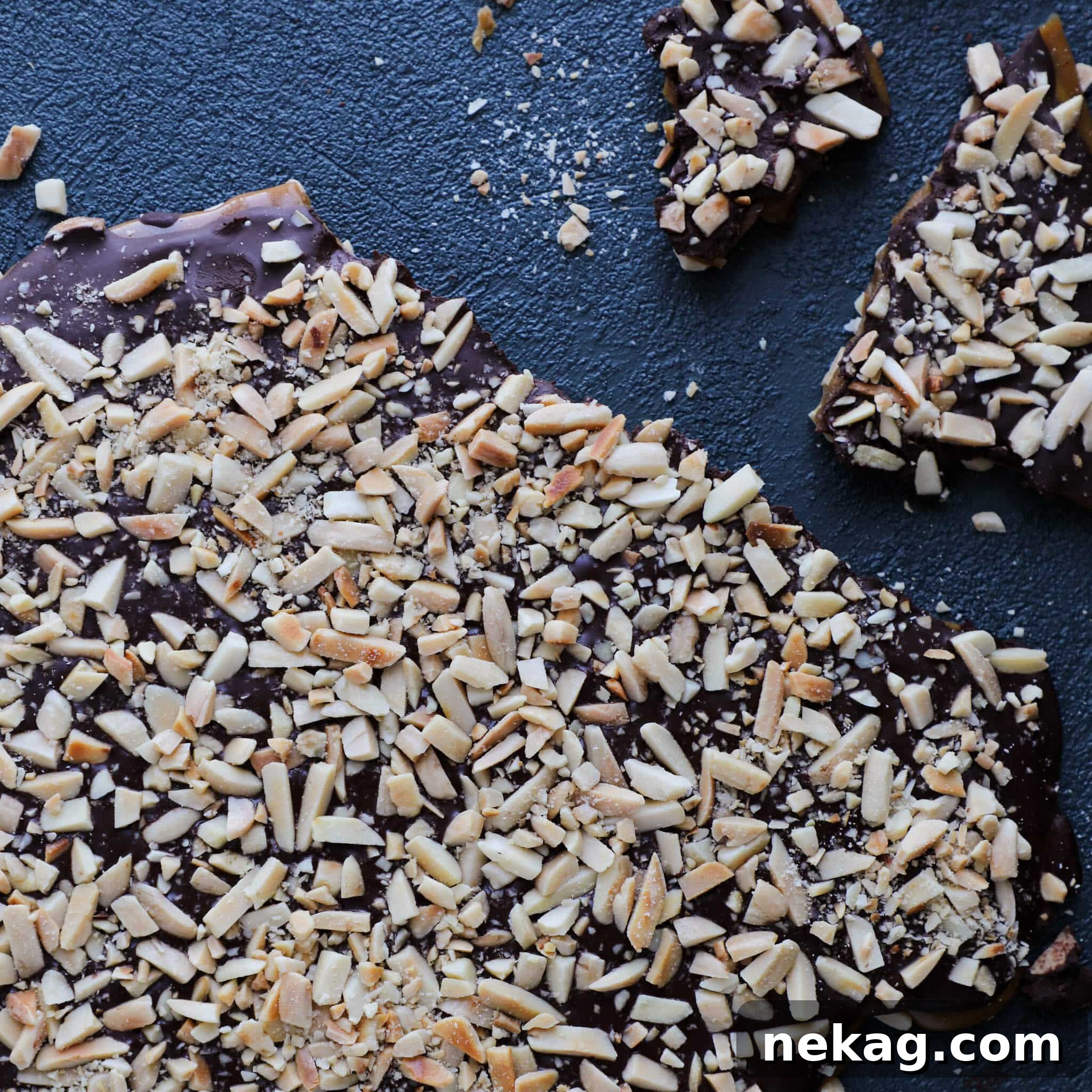 Whip Up Delicious Homemade Toffee 4 Homemade Toffee on Blue Background: A sheet of cooked toffee with melted chocolate and nuts