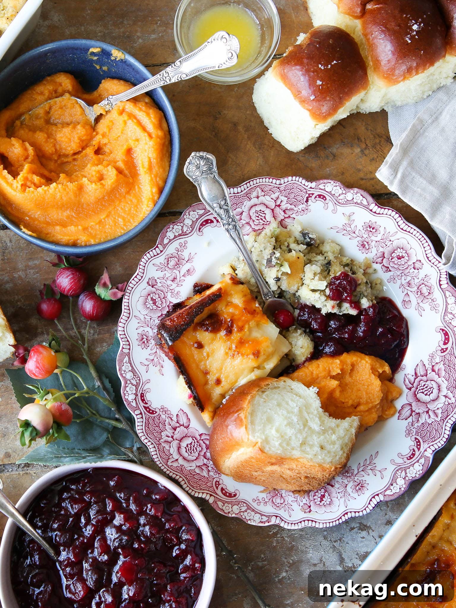 A beautifully arranged selection of Thanksgiving side dishes on pink plates, ready to be served at a festive table.
