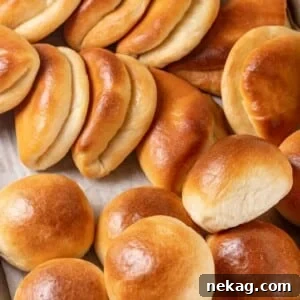 A generous serving of golden Parker House Rolls, ready to be pulled apart.