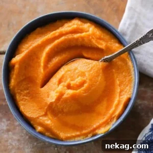 Maple Mashed Sweet Potatoes elegantly served in a blue bowl.