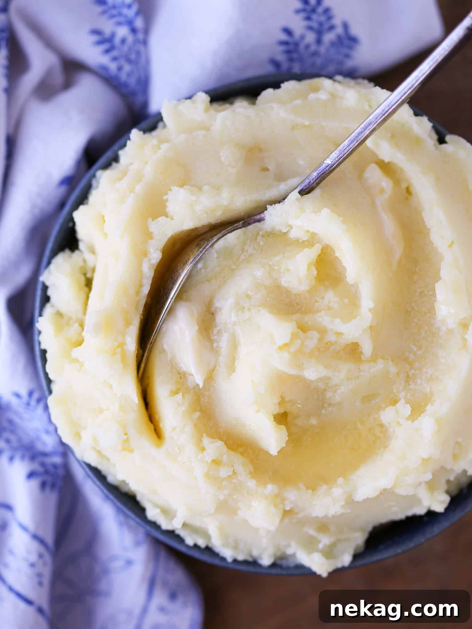 Creamy Mashed Potatoes, lusciously topped with melted butter, a staple among the 30 best Thanksgiving side dishes.