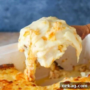 Scalloped Potatoes beautifully arranged on a wooden server.