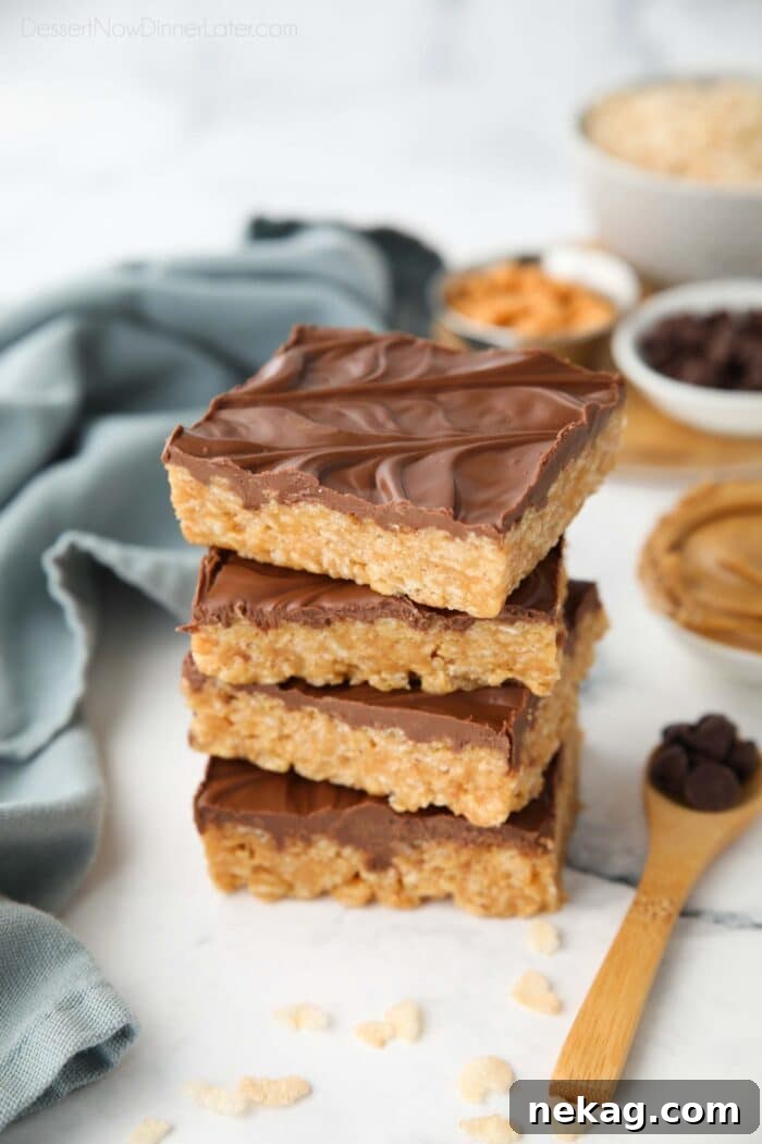A beautiful stack of Scotcharoos, showcasing the rich chocolate and butterscotch topping layered over the peanut butter rice krispie base.