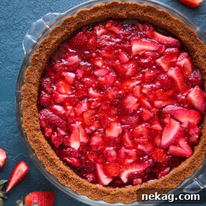 A round image of a No Bake Strawberry Triumph Pie with a gingersnap crust.