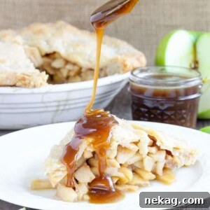 A round image of a Butterscotch Apple Pie, lightly spiced apples baked inside a flaky all-butter crust with brown sugar butterscotch sauce.