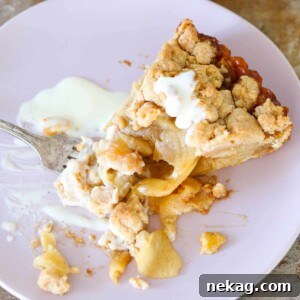 A round image of a Caramel Apple Tart with cinnamon streusel.