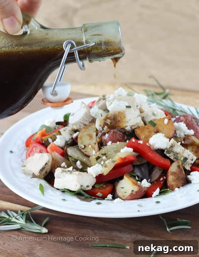 Warm Lemon Rosemary Roasted Vegetable Salad topped with grilled chicken