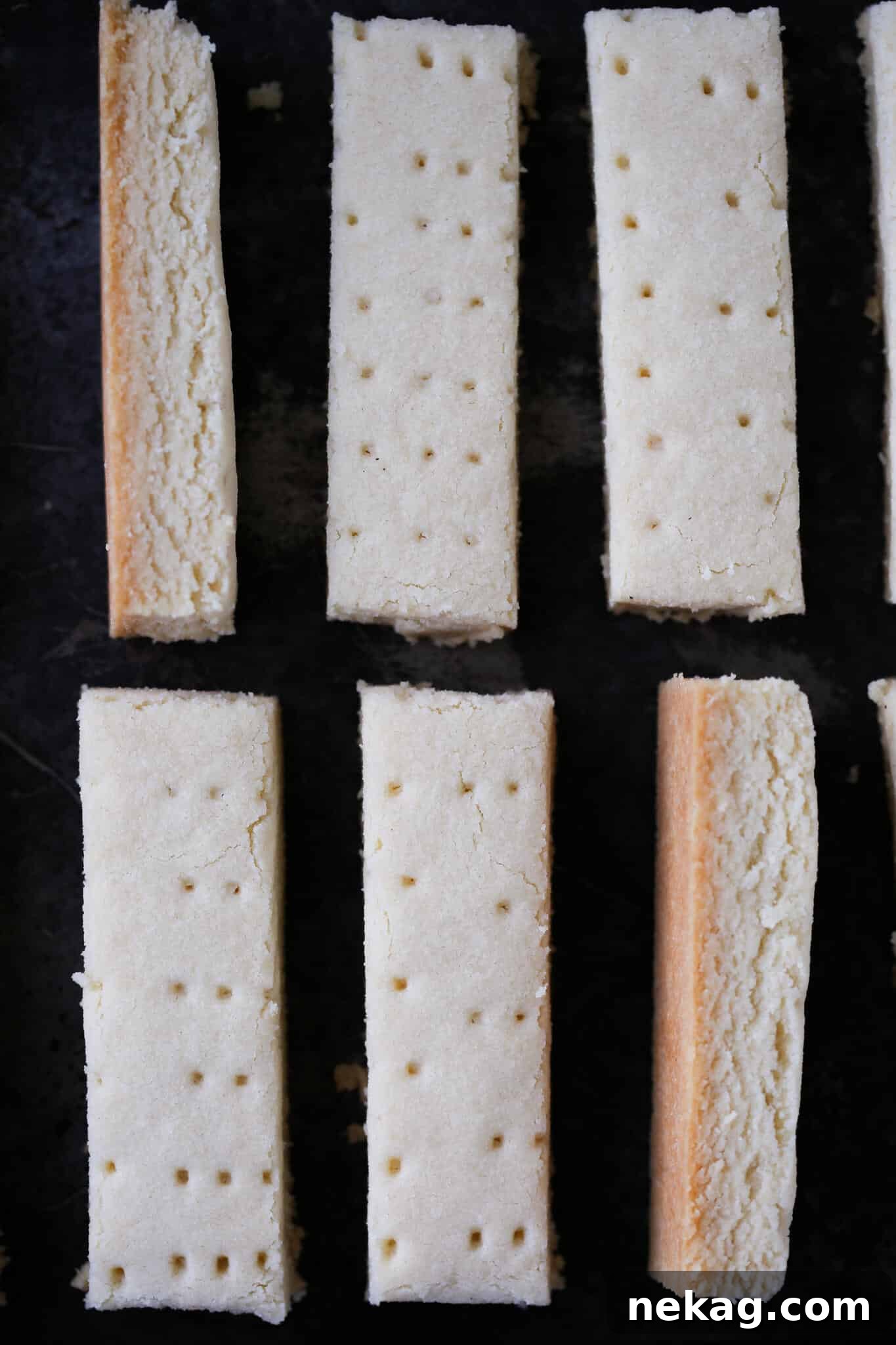 Scottish shortbread cut and placed on black background.