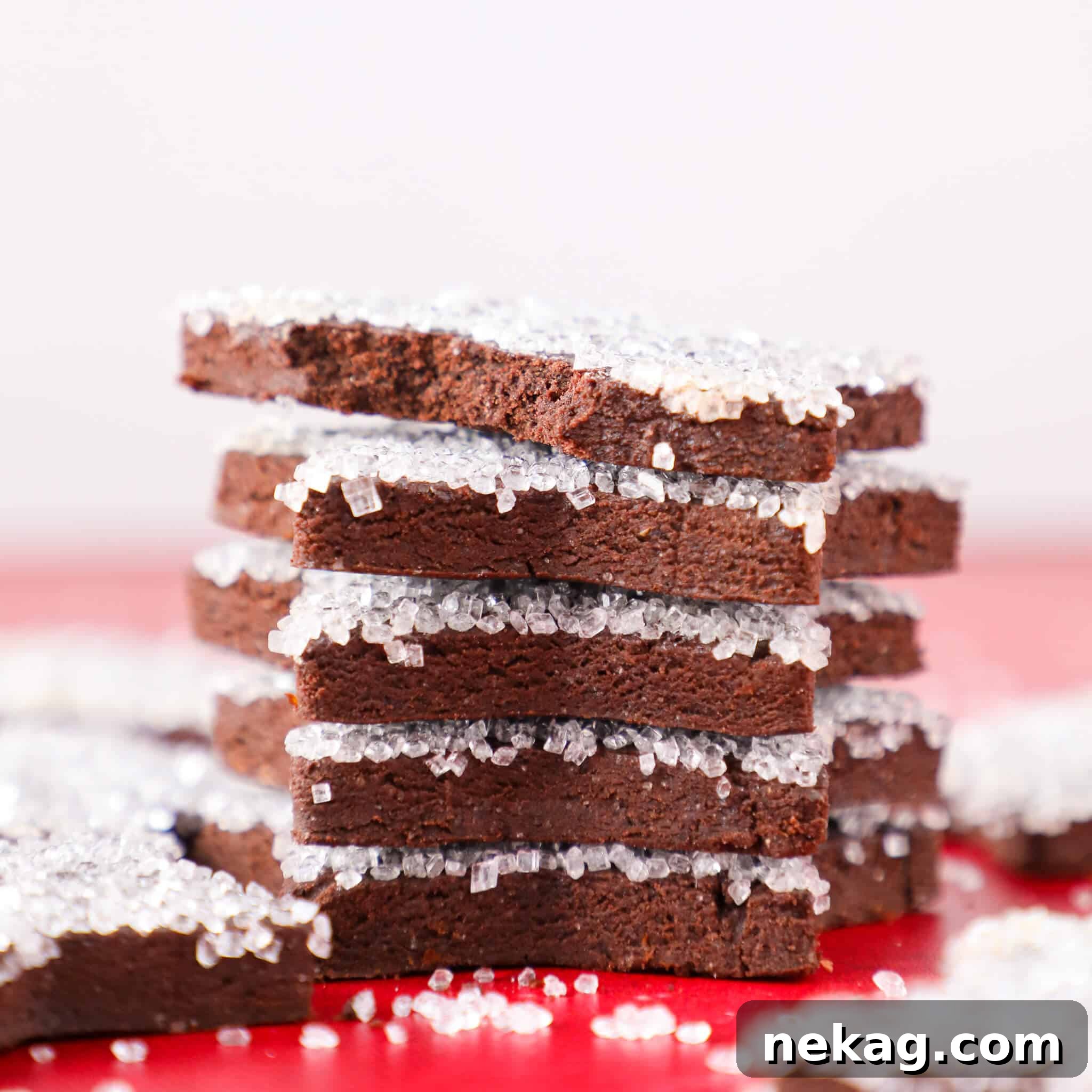 Orange-Kissed Chocolate Shortbread 5 Stack of sparkling Christmas cookies against a festive background