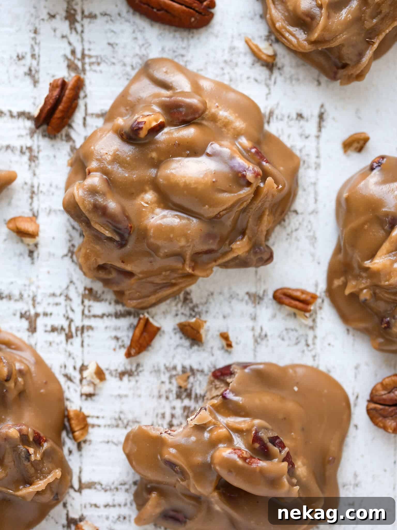 Caramelized Pecan Indulgence 2 Caramel colored top of a pecan praline studded with nuts, showcasing its rich texture.
