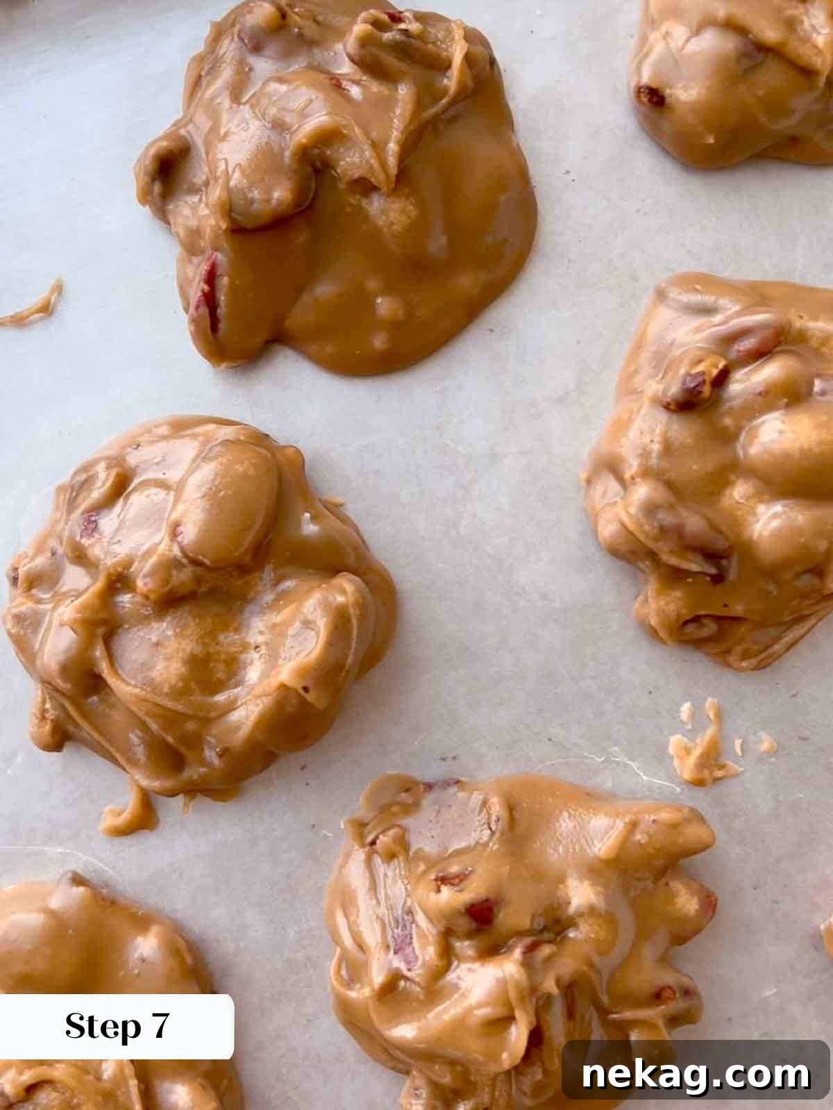 Caramelized Pecan Indulgence 11 Freshly dropped pralines cooling and setting on waxed paper.