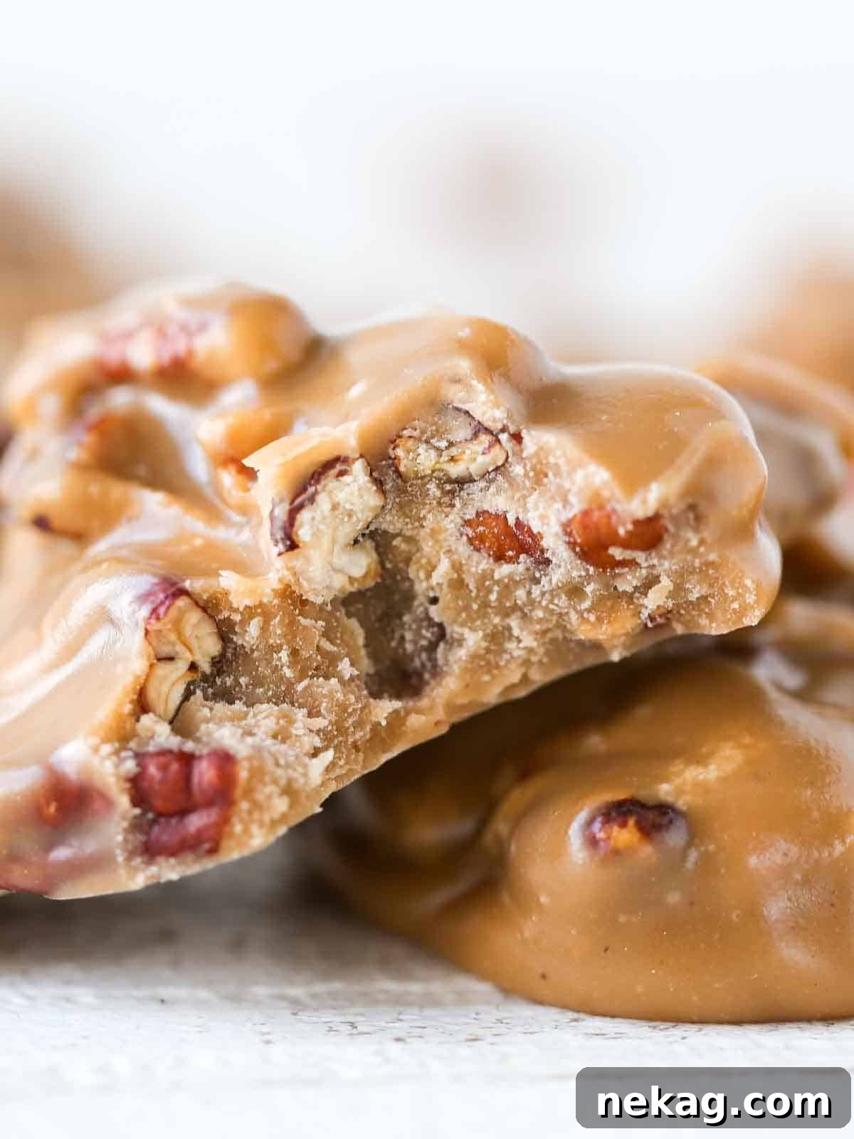 Caramelized Pecan Indulgence 3 Close-up of a perfect praline interior, showing the creamy texture and embedded pecans.