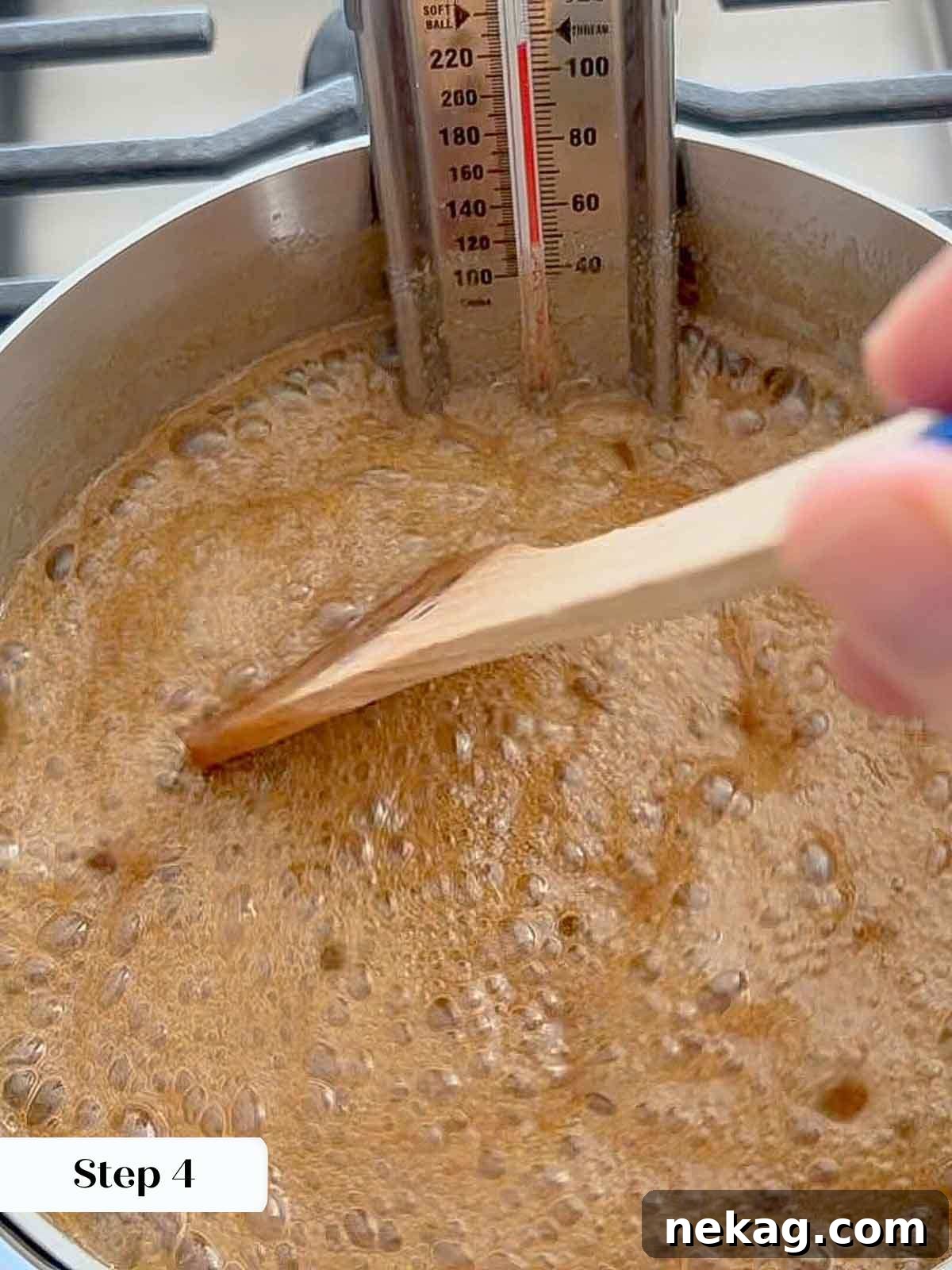 Caramelized Pecan Indulgence 6 Praline candy mixture boiling with a candy thermometer attached, indicating correct temperature.