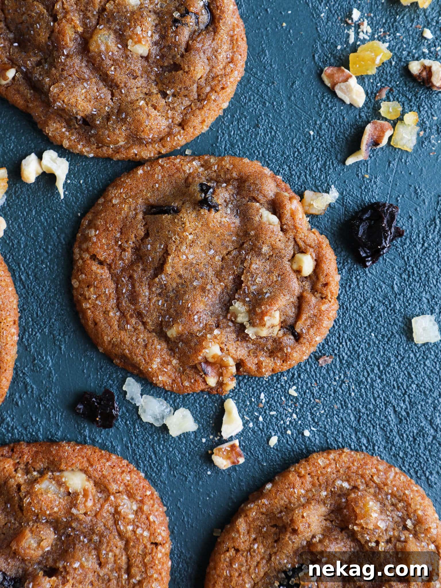 Cherry Orange Molasses Cookies displayed on a vibrant blue background, highlighting their festive appeal.