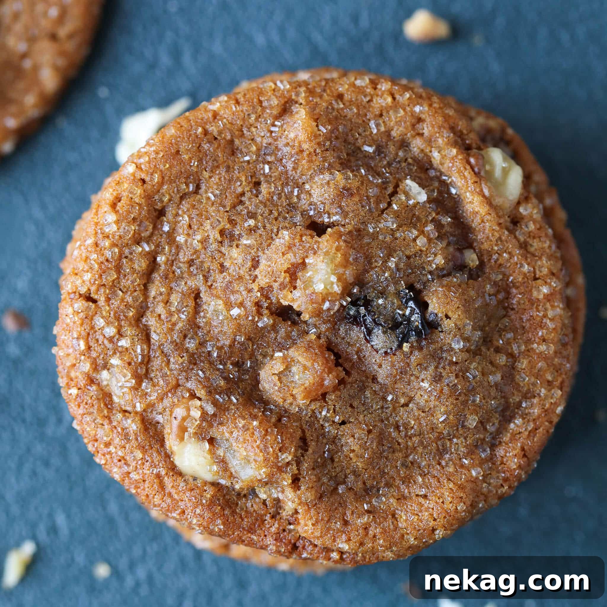 Close-up of freshly baked Cherry Orange Molasses Cookies, showing their perfectly cracked tops and rich color.