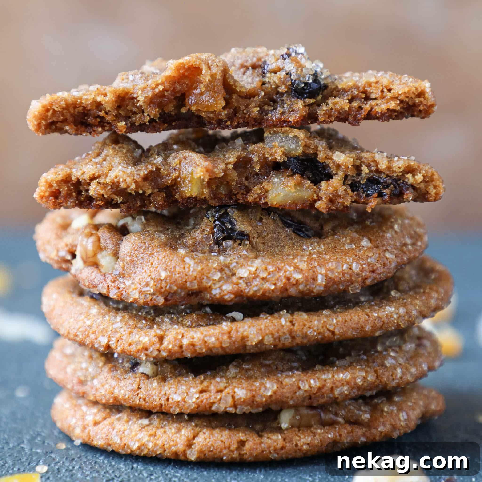 Interior view of a Cherry Orange Molasses Cookie amongst other Christmas treats, highlighting its texture.