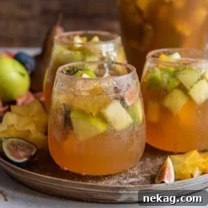 Spiced Fall Sangria garnished with autumn fruits.