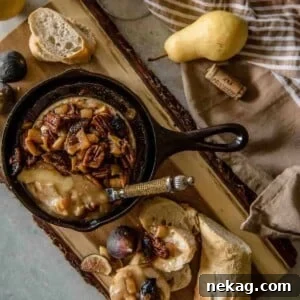 Brown Butter Fig & Pear Baked Brie, warm and ready to serve.