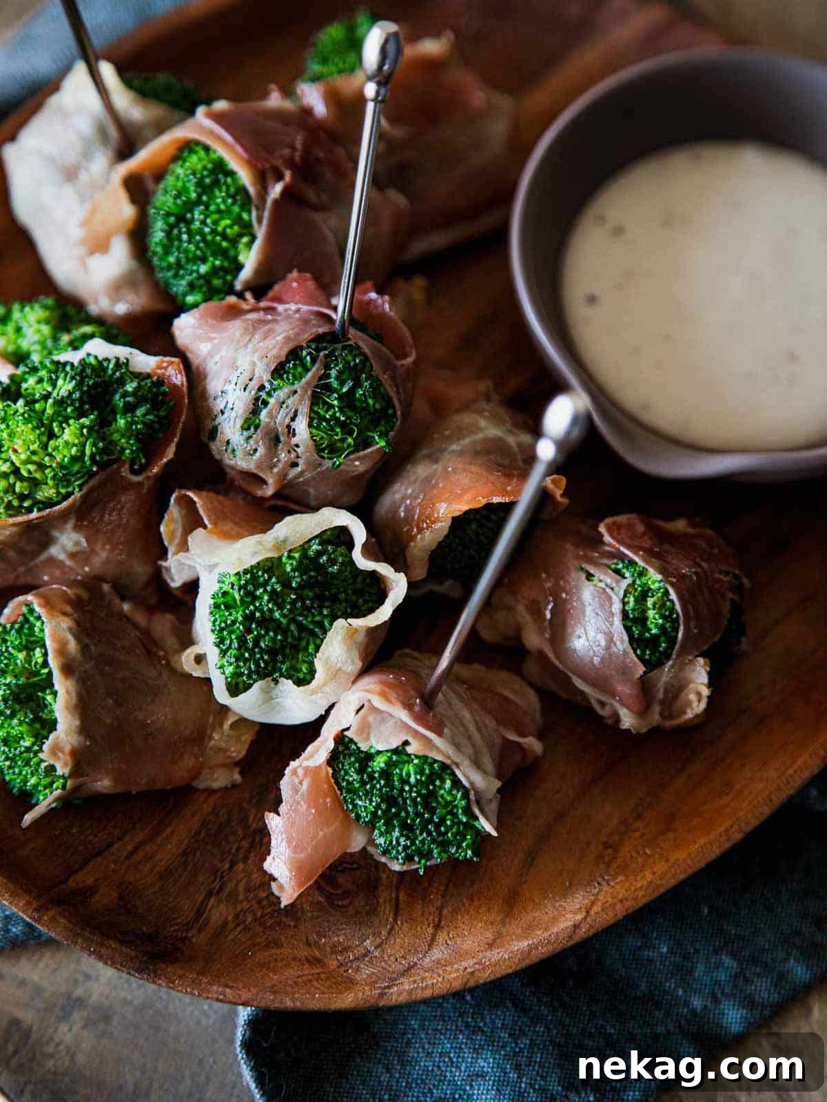 Vibrant green broccoli florets delicately wrapped in salty prosciutto, a simple yet elegant appetizer.