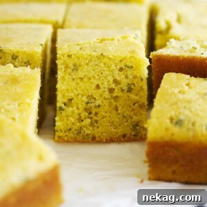 Squares of herb cornbread, fragrant and moist.
