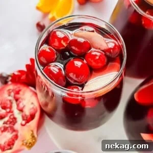 Glass full of red Thanksgiving sangria.