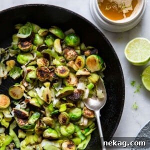 Brussels Sprouts and Leeks with Lime ginger butter in skillet.
