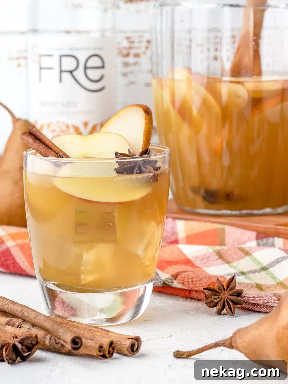 Refreshing apple cider mocktail in a glass with elegant garnish, perfect for a non-alcoholic option.