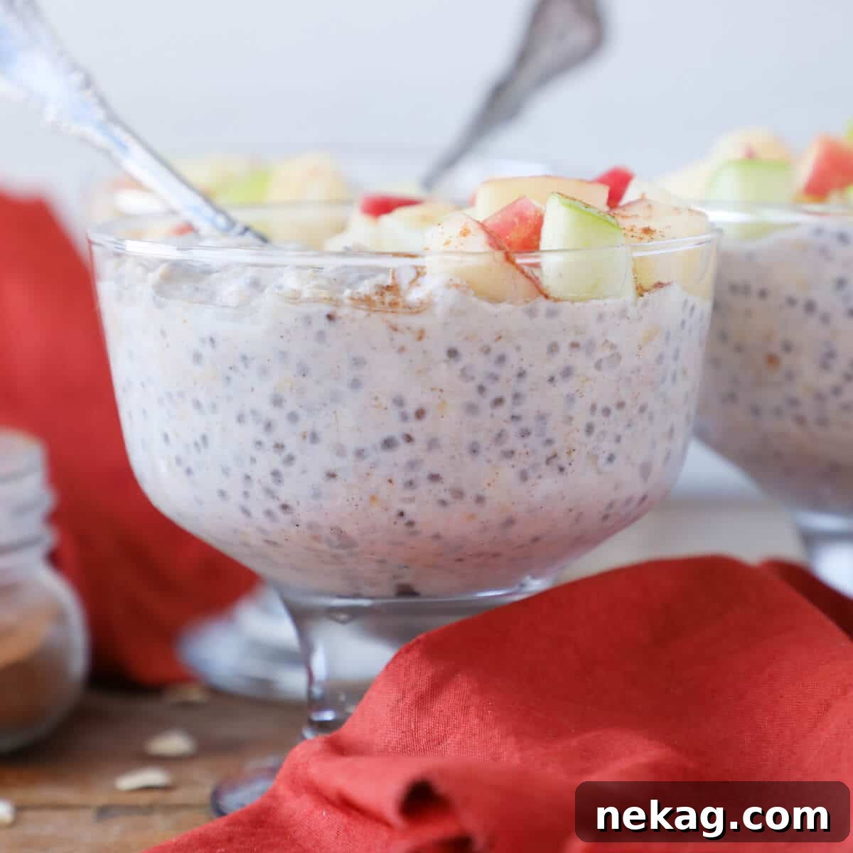 Spiced Apple Pie Overnight Oats 3 Creamy Apple Pie Overnight Oats with grated apple and a spoon