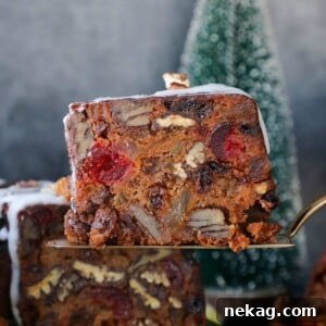 Delicious Fruit Cake serving with rich texture and vibrant fruits.