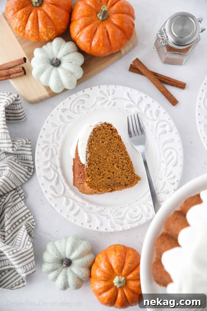 Spiced Pumpkin Crown 4 Slice of pumpkin bundt cake on a plate with a fork.