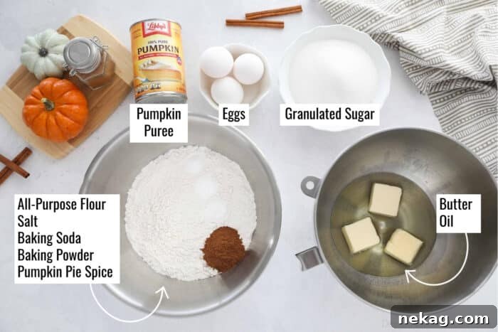 Spiced Pumpkin Crown 6 Pumpkin bundt cake ingredients in bowls and cans, labeled. Pumpkin puree, eggs, granulated sugar, all-purpose flour, salt, baking soda, baking powder, pumpkin pie spice, butter, and oil.