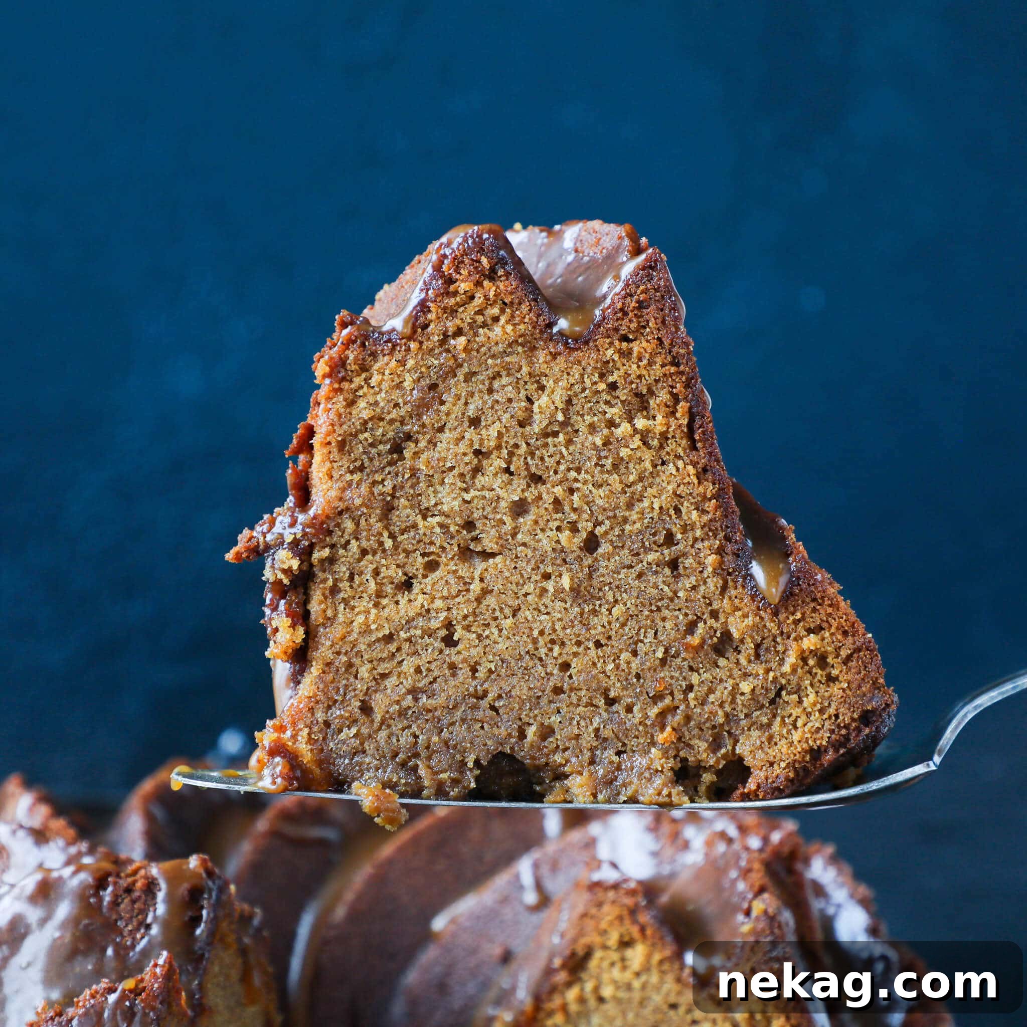 Sticky Caramel Molasses Pound Cake 3 A close-up view of a slice of Caramel Molasses Pound Cake, revealing its moist, dense crumb and rich color.